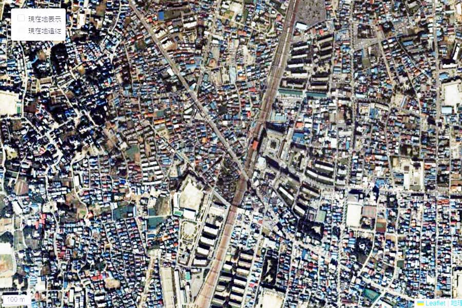 1985年頃に撮影された「竹ノ塚駅」周辺の航空写真（画像：国土地理院）