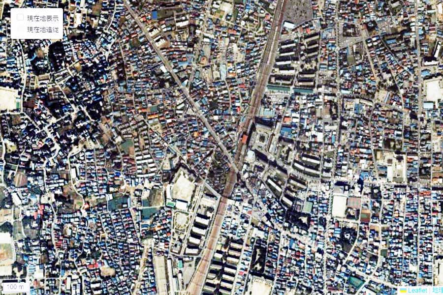 1985年頃に撮影された「竹ノ塚駅」周辺の航空写真（画像：国土地理院）