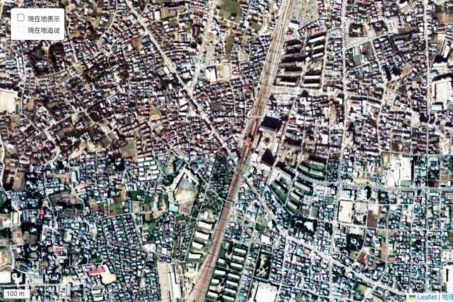 1980年頃に撮影された「竹ノ塚駅」周辺の航空写真（画像：国土地理院）