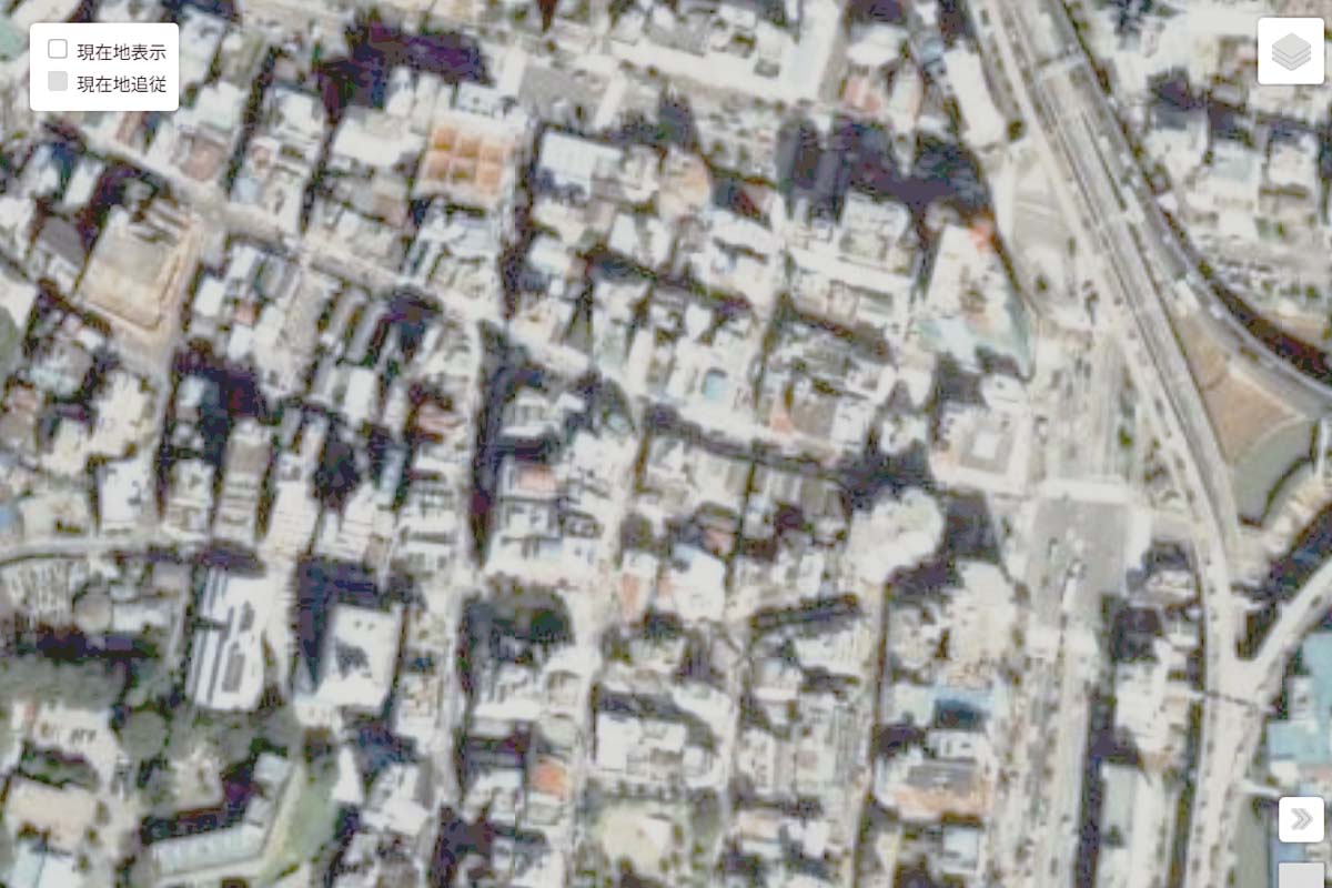 1990年頃の「麻布十番駅」周辺の航空写真（画像：国土地理院）