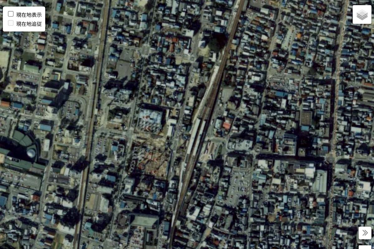 1990年頃の「豊田市駅」周辺の航空写真（画像：国土地理院）